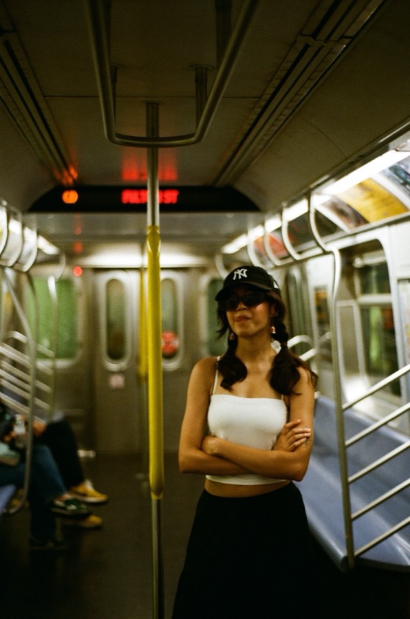 Tanvi on the NYC subway, approaching Fulton St