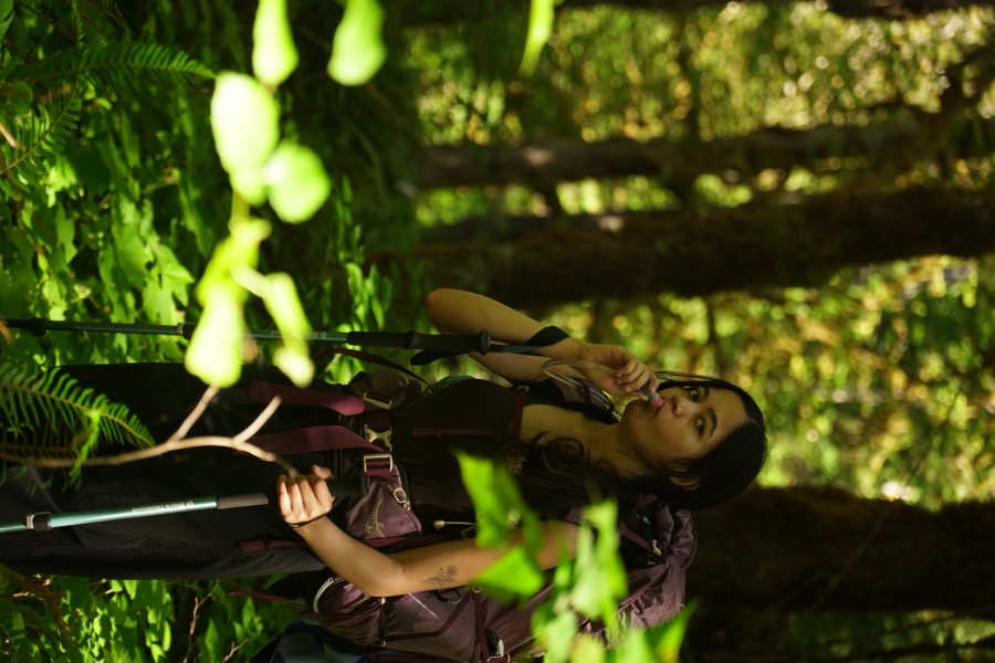 Tanvi, hydrating, while on the Enchanted Valley trail